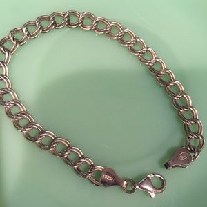 925 Sterling Silver 7” charm bracelet.